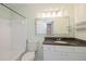 Clean bathroom with a tub, shower, and a granite vanity at 2501 Grassy Point Dr # 107, Lake Mary, FL 32746