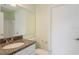 Bathroom featuring granite countertop and neutral tile at 2501 Grassy Point Dr # 107, Lake Mary, FL 32746