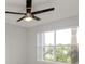 Bedroom featuring a ceiling fan and a window at 2501 Grassy Point Dr # 107, Lake Mary, FL 32746