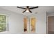 Bedroom has ceiling fan and light with entrance to ensuite bath and closet at 2501 Grassy Point Dr # 107, Lake Mary, FL 32746