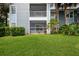 Exterior view of the property featuring well-maintained landscaping at 2501 Grassy Point Dr # 107, Lake Mary, FL 32746