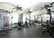 Community gym with weights, machines, mirrors, and plenty of space to exercise at 2501 Grassy Point Dr # 107, Lake Mary, FL 32746