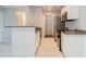 Well-lit kitchen with stainless steel appliances, granite countertops, and ample cabinet space at 2501 Grassy Point Dr # 107, Lake Mary, FL 32746
