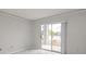 Living room with sliding glass doors leads to private balcony with water view at 2501 Grassy Point Dr # 107, Lake Mary, FL 32746