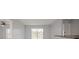 Open concept living area with lake views and sliding glass doors for access at 2501 Grassy Point Dr # 107, Lake Mary, FL 32746