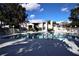 Enjoy a community swimming pool surrounded by lush greenery and seating at 2501 Grassy Point Dr # 107, Lake Mary, FL 32746