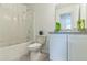 Bathroom with white cabinets, shower with curtain, toilet, and decorative accents at 3028 Water Sprite St, Orlando, FL 32808