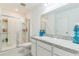 Modern bathroom features granite countertops, a glass-enclosed shower, and sleek fixtures at 3028 Water Sprite St, Orlando, FL 32808