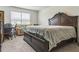 Spacious bedroom with a large bed, sitting area, and bright window at 3028 Water Sprite St, Orlando, FL 32808