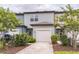 Charming two-story townhouse with a one car garage and well-manicured landscaping at 3028 Water Sprite St, Orlando, FL 32808