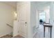 Bright hallway with carpet flooring and white doors leading to other rooms at 3028 Water Sprite St, Orlando, FL 32808