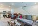 Well-lit living space featuring a staircase, comfortable seating and open design flowing into kitchen at 3028 Water Sprite St, Orlando, FL 32808