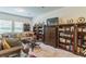 Inviting living room with plush sofa, decorative bookshelves, and a well-placed entertainment center at 3028 Water Sprite St, Orlando, FL 32808