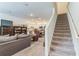 Spacious living room seamlessly flows into an open kitchen area, creating an inviting atmosphere at 3028 Water Sprite St, Orlando, FL 32808