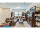 Cozy living area with a large sectional sofa, classic decor, and abundant natural light at 3028 Water Sprite St, Orlando, FL 32808