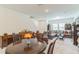 Bright and airy living room adjacent to dining area, perfect for entertaining and relaxation at 3028 Water Sprite St, Orlando, FL 32808