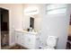 Bathroom featuring a double sink vanity and ample storage, providing a functional space at 309 E 13Th St, Apopka, FL 32703