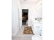 Bathroom leading to a bedroom, creating a private ensuite, blending comfort at 309 E 13Th St, Apopka, FL 32703