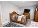 Cozy bedroom with wood-look floors, a comfy bed, and natural light at 309 E 13Th St, Apopka, FL 32703