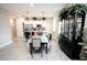 Bright open-concept dining area and kitchen combo featuring tile floors and natural light at 309 E 13Th St, Apopka, FL 32703