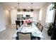 Open concept dining area features tile floors with natural light at 309 E 13Th St, Apopka, FL 32703