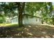 A charming home surrounded by mature trees, offering shade and privacy at 309 E 13Th St, Apopka, FL 32703