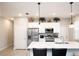 Modern kitchen with white cabinets, stainless steel appliances, and a center island at 309 E 13Th St, Apopka, FL 32703