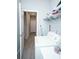 Laundry room features an open doorway and white washer and dryer at 309 E 13Th St, Apopka, FL 32703