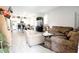 Spacious living room with tile floors and an open floor plan to the kitchen at 309 E 13Th St, Apopka, FL 32703