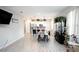 Open-concept space combining the living room, dining area, and kitchen at 309 E 13Th St, Apopka, FL 32703