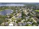 A scenic aerial view showcases a waterfront neighborhood featuring serene lake views and lush greenery at 3535 Lake Sarah Dr, Orlando, FL 32804