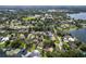 An expansive aerial view of a neighborhood by a lake, highlighting the scenic beauty and peaceful surroundings at 3535 Lake Sarah Dr, Orlando, FL 32804