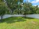 Spacious fenced backyard featuring mature trees, providing shade and a sense of tranquility at 3535 Lake Sarah Dr, Orlando, FL 32804