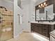 This bathroom features a glass shower, tile floor, and a vanity with large mirror at 3535 Lake Sarah Dr, Orlando, FL 32804
