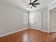 Bedroom with hardwood floors, crown moulding, and a double door closet at 3535 Lake Sarah Dr, Orlando, FL 32804