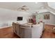 Bright bonus room with media center, eat-in table, hardwood floors, and comfortable seating at 3535 Lake Sarah Dr, Orlando, FL 32804