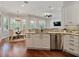 Well-lit kitchen with marble countertops, stainless steel appliances, and an adjacent dining area at 3535 Lake Sarah Dr, Orlando, FL 32804