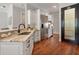 Bright kitchen features granite countertops, stainless steel appliances, and hardwood floors at 3535 Lake Sarah Dr, Orlando, FL 32804