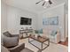 Comfortable living room features a ceiling fan and a large rug at 3535 Lake Sarah Dr, Orlando, FL 32804