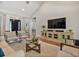 Spacious living room featuring vaulted ceilings, neutral tones, and a clear view of the foyer at 3535 Lake Sarah Dr, Orlando, FL 32804