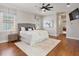 Stylish main bedroom features modern decor, hardwood floors, and an en-suite bathroom at 3535 Lake Sarah Dr, Orlando, FL 32804