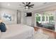 Serene main bedroom with a view of the outdoor living area and backyard at 3535 Lake Sarah Dr, Orlando, FL 32804