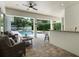 Covered patio with outdoor seating, a ceiling fan, and a view of the pool at 3535 Lake Sarah Dr, Orlando, FL 32804
