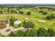 Aerial view of community with lush golf course landscaping at 36730 Oconee Ave, Eustis, FL 32736