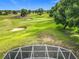 Enjoy the tranquil backyard view of this property overlooking a well-maintained golf course at 36730 Oconee Ave, Eustis, FL 32736