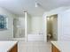 Bathroom featuring a tub, a shower, and a toilet, providing a functional layout at 36730 Oconee Ave, Eustis, FL 32736