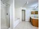 Bathroom featuring a tub, a shower, a vanity, and tile flooring, a practical space at 36730 Oconee Ave, Eustis, FL 32736