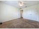 Bedroom showcasing neutral walls and carpet with a closet at 36730 Oconee Ave, Eustis, FL 32736