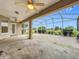 Spacious covered patio with ceiling fans, offering stunning views of the golf course at 36730 Oconee Ave, Eustis, FL 32736