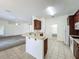 Well-equipped kitchen includes modern appliances, dark cabinets, and bar seating at 36730 Oconee Ave, Eustis, FL 32736